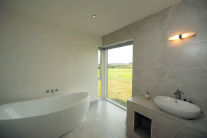 contemporary bathroom with a view by cork builder niall linehan construction